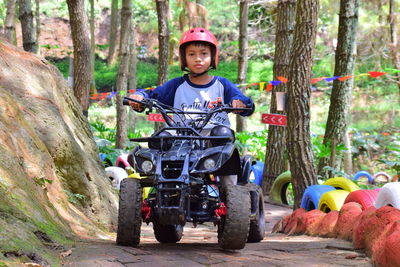 Portrait of boy riding atv