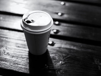 Close-up of wooden cup on table