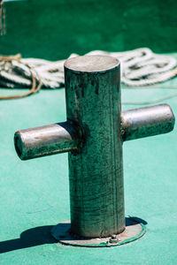 Close-up of old rusty railing against sea