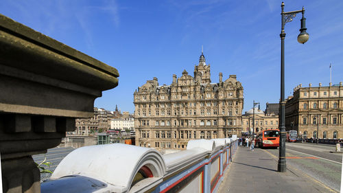 Cars on road against buildings