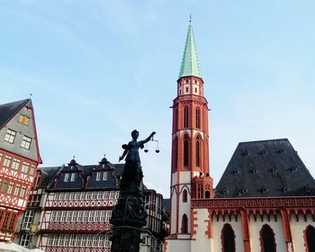 Low angle view of statue of building against sky