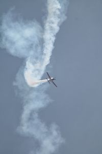 Low angle view of airplane flying in sky