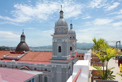 View of buildings in city against sky