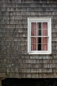 Full frame shot of window on wall of building