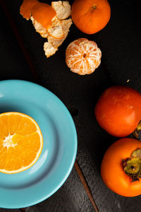 High angle view of orange fruits on table