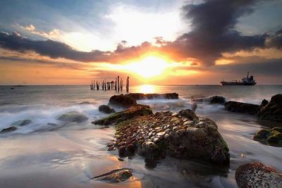 Scenic view of sea at sunset