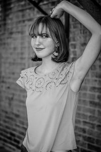 Portrait of smiling young woman standing outdoors