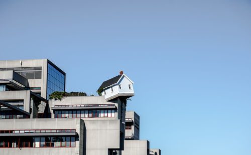 Low angle view of buildings against clear sky