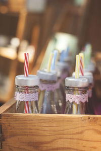 Close-up of straws in bottles