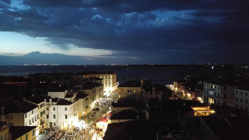 Cityscape against cloudy sky