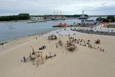 High angle view of people on beach against sky