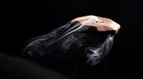 Close-up of smoke against black background