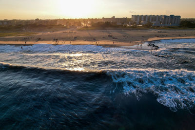 Scenic view of the jersey shore against sky during sunset