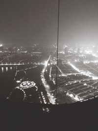Aerial view of illuminated city at night