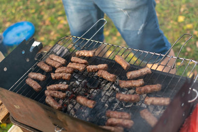 Man preparing food on barbecue grill