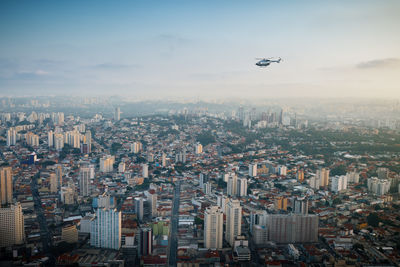 Aerial view of cityscape against sky