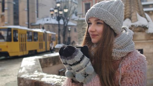 Portrait of young woman in snow