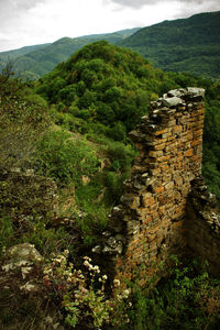 High angle view of stone wall with mountain in background