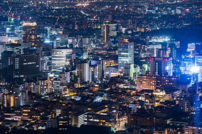 High angle view of illuminated buildings at night