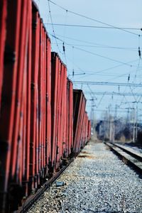 Red freight train on railroad track