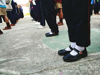 Low section of people standing on floor