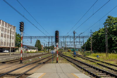 Railroad tracks against clear blue sky, train station in elblag, poland