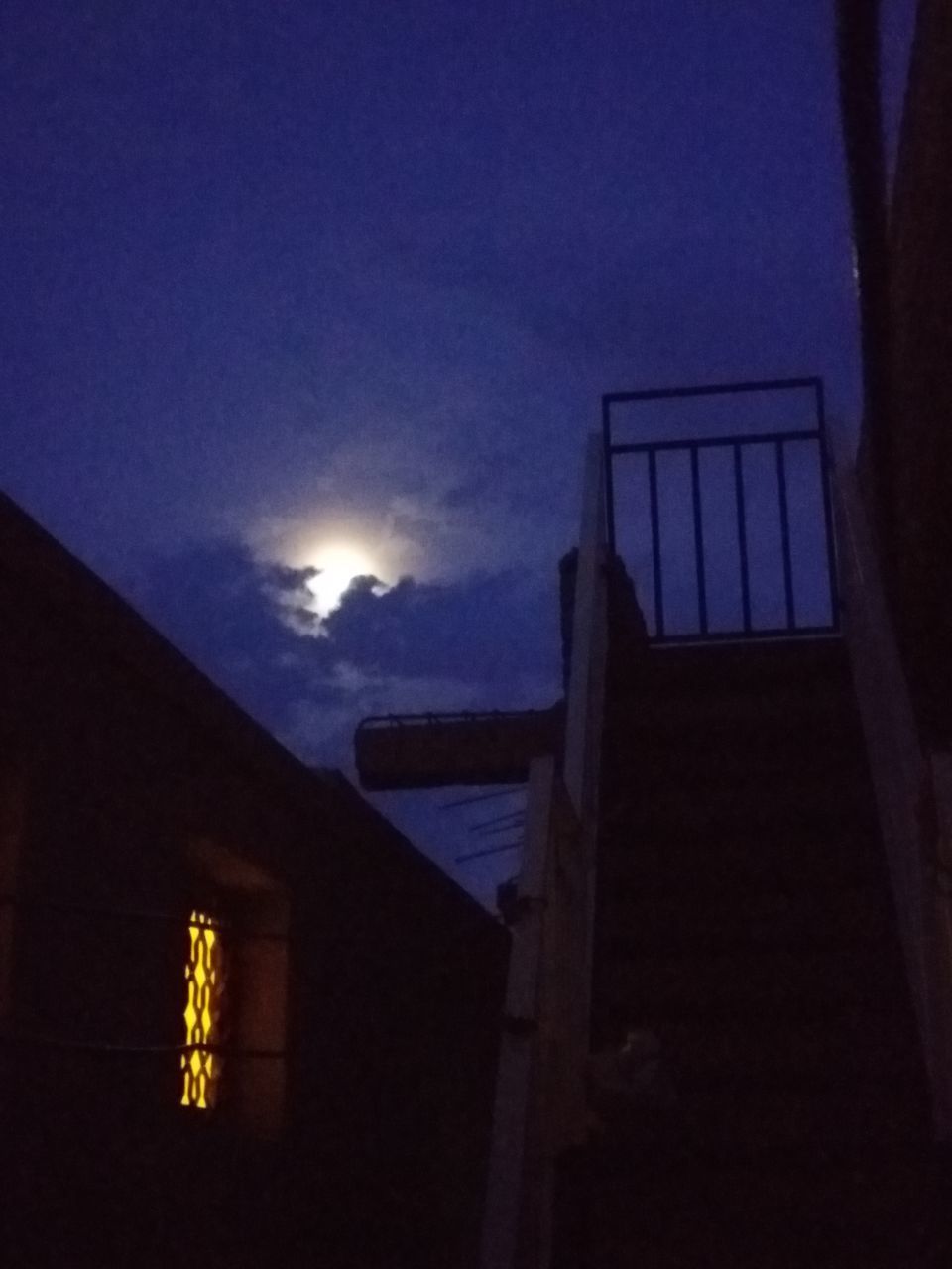 architecture, built structure, building exterior, sky, night, building, low angle view, cloud - sky, illuminated, no people, house, nature, outdoors, residential district, dusk, moon, window, dark, silhouette, blue, moonlight