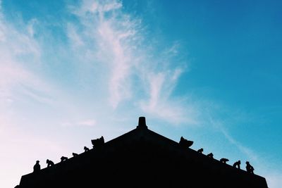 Low angle view of building against blue sky