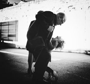 Woman walking on road