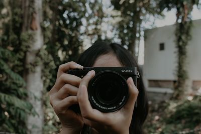 Portrait of woman photographing