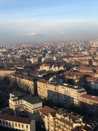 High angle view of buildings in city against sky