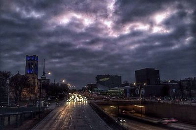 City street against cloudy sky