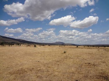 Panoramic view of arid landscape against sky