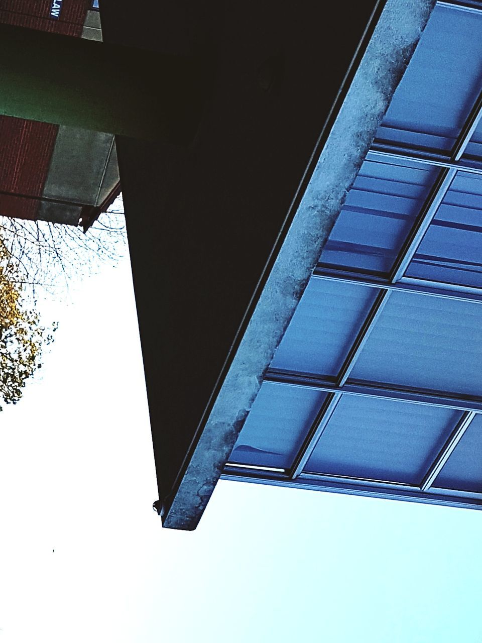 architecture, sky, low angle view, built structure, building exterior, no people, nature, day, building, blue, window, glass - material, roof, outdoors, clear sky, reflection, pattern, directly below, tree, glass