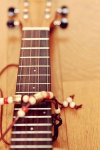 Close-up of guitar playing on table
