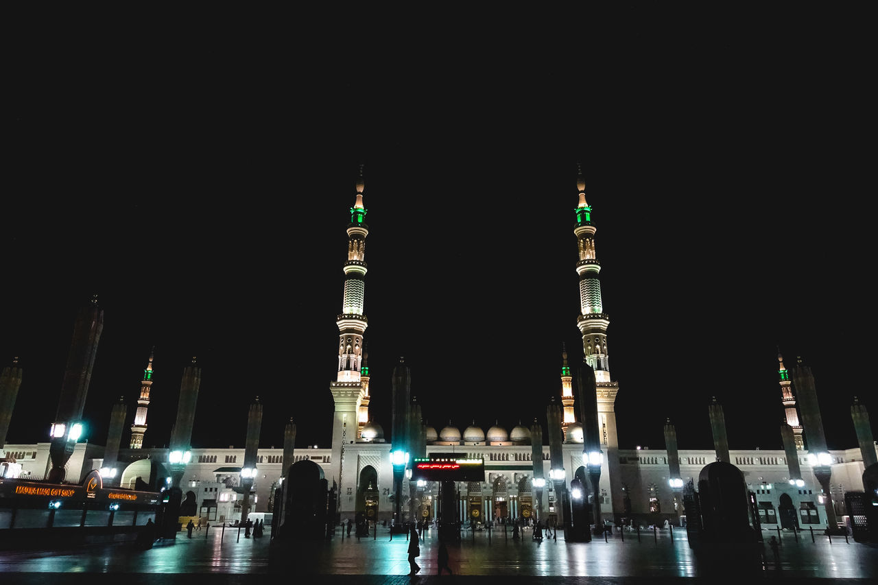 VIEW OF ILLUMINATED CITY AT NIGHT