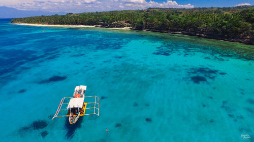 High angle view of boat in sea against sky