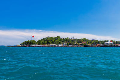 Scenic view of sea against clear blue sky