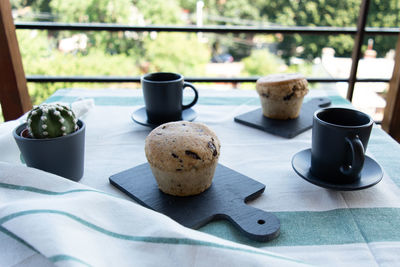 Close-up of coffee and cups on table