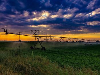 Scenic view of field against sky during sunset