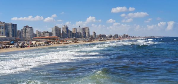 Gaza city beach ,blue sky and buildings  front of sea