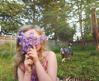 Young woman with dog on flower