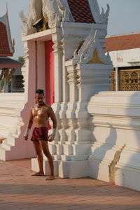 Shirtless man at temple