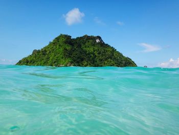 Scenic view of sea against blue sky