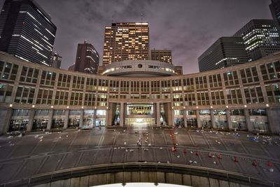 Illuminated buildings in city at night