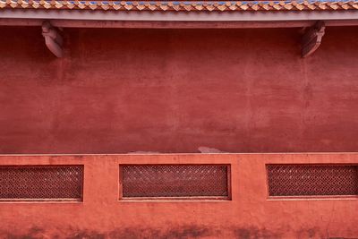 Low angle view of window on building wall