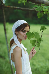 Midsection of woman holding plant