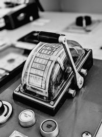 High angle view of old telephone booth on table