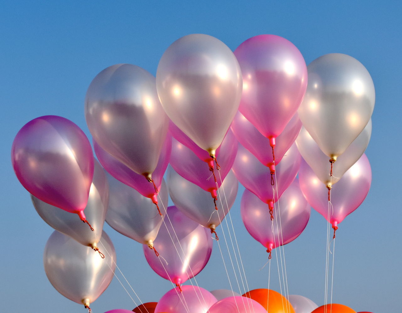 LOW ANGLE VIEW OF BALLOONS