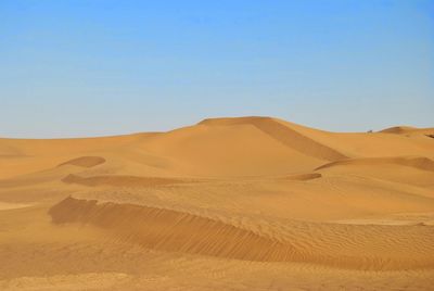 Scenic view of desert against clear sky